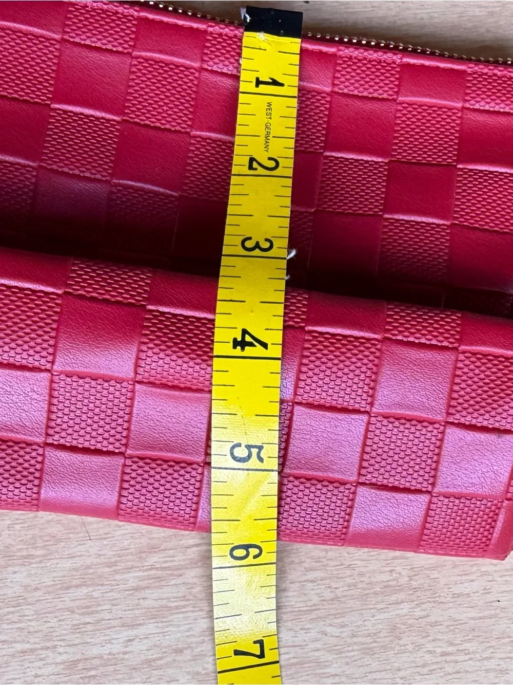 Jo Malone London cosmetic bag features a vibrant red woven design